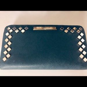 Hunter Green Wallet with gold zipper.